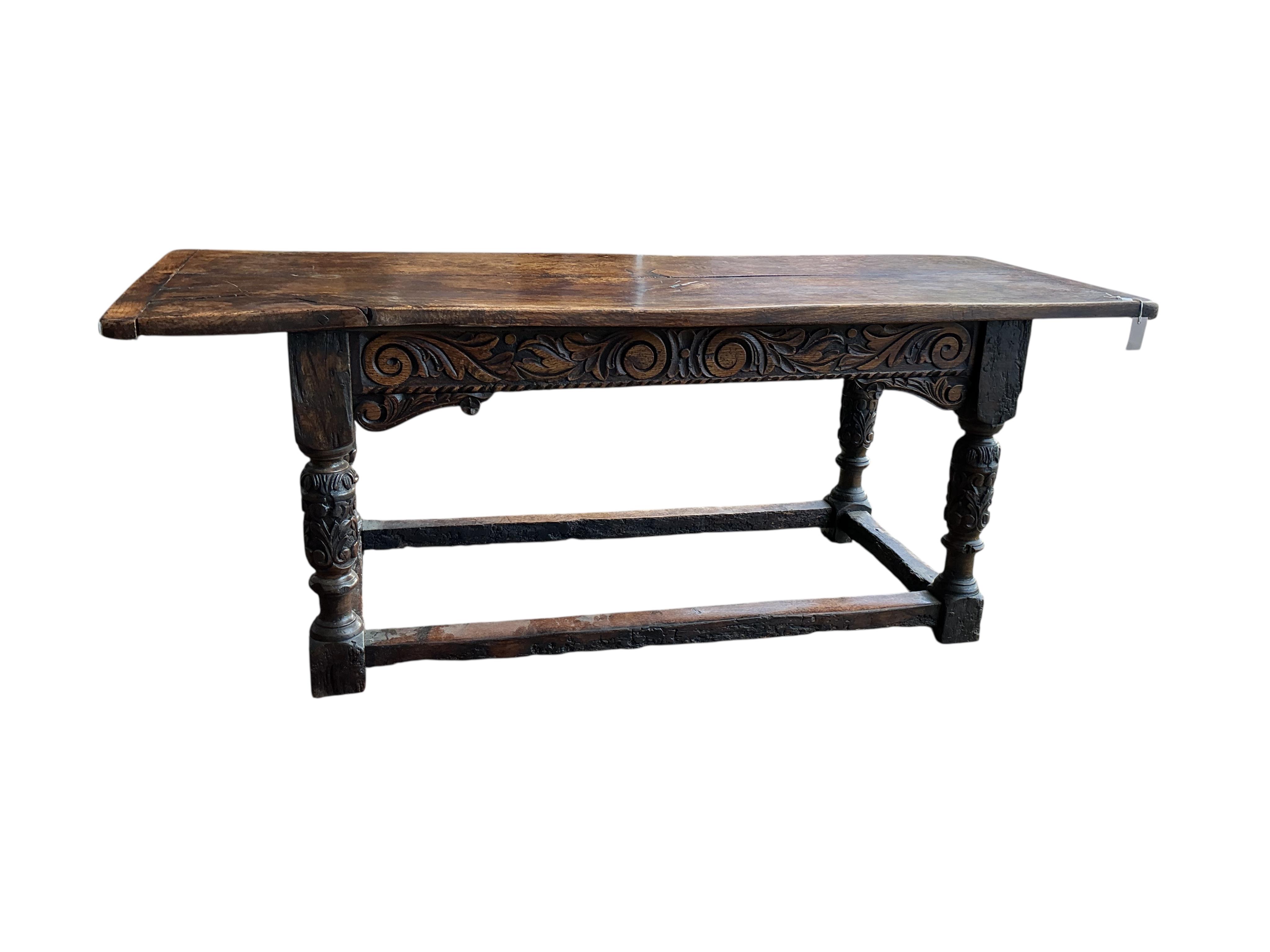 A 17th century style carved oak rectangular refectory table, incorporates old timber, width 198cm, depth 75cm, height 76cm